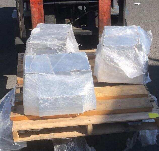 The shipment contained three aluminum blocks, shrink-wrapped and palletized, each weighing approximately 165 pounds.